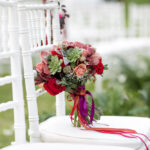 Stunning,Red,Bridal,Bouquet,On,White,Chair.,Wedding,Ceremony.,Mix